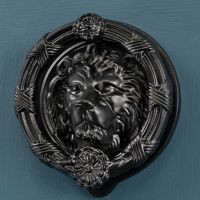 The "Langdon Court" Black Lion Head Door Knocker Shown Close up on a Blue Door - Digital Illustration