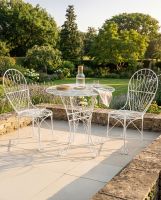 The "Maddie’s Picnic" 2-Seater Garden Dining Set in Situ in the Garden. digital illustration dressed table