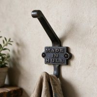 The "Made in Hull" Iron Coat Hook on a Cream Coloured wall in a Traditional Home - Digital Illustration