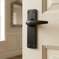 The "Marcello" Smooth Lever Latch Set on a White Wooden Door in a Period Home - Digital Illustration
