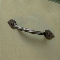 The "Mira" Twist Pull Handle Mounted on a Contemporary Green Kitchen Cabinet - Digital Illustration
