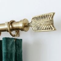 The "Nottingham Fletch" Curtain Finial Mounted on a Matching Curtain Pole in a Contemporary Living Room Shown Close up- Digital Illustration The "Nottingham Fletch" Curtain Finial Mounted on a Matching Curtain Pole in a Contemporary Living Room Shown Close up- Digital Illustration