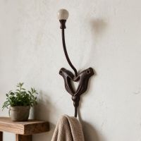 The "Pilgrims Hands" Iron Hook Mounted on a Wall with a Cardigan Hanging From it - Digital Illustration The "Pilgrims Hands" Iron Hook Mounted on a Wall with a Cardigan Hanging From it - Digital Illustration