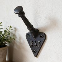 The "RAF" Iron Coat Hook Shown Close up on a White Wall - Digital Illustration
