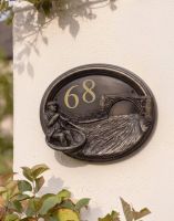 The "Rivervalley Gorge" Coracle Sailor House Sign on a Smooth Cream Coloured Wall on the Outside of a Home - Digital Illustration 