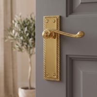 The "Saint Georgia" Lever Handle Square Plate on a Grey Door in a Modern Home - Digital Illustration