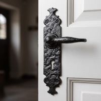 The "Shiredale" Antique Cast Iron Lever Handles with Key Hole on a White Wooden Door in a Traditional Home Hallway - Digital Illustration