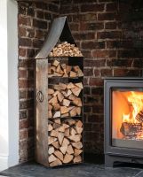 The "The Tower" Steel Log & Kindling Store packed with Wood next to a Log Burner Stove in a White Living Room Interior - Digital Illustration The "The Tower" Steel Log & Kindling Store packed with Wood next to a Log Burner Stove in a White Living Room Interior - Digital Illustration