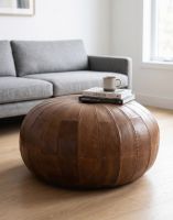 The "The Woodstock" Natural Brown Leather Round Pouffe in a White Contemporary Living Room - Digital Illustration