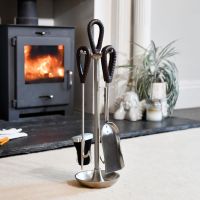 The "Tundra" Pewter Companion Set With Leather Handles in Front of a Modern Fireplace  - Digital Illustration 