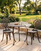 The "Wentworth" 2-Seater Garden Dining Set - Brushed Gold digital illustration dressed table