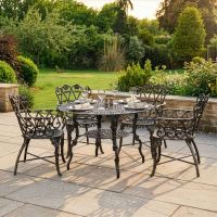 The "Wootton House" 4-Seater Outdoor Dining Set - Brushed Gold digital illustration dressed table