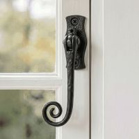 The "Wrestford Hall" Black Monkeytail Iron Window Fastener Mounted on a Traditional White Window Frame - Digital Illustration