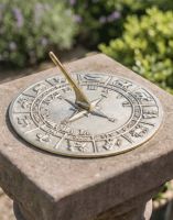 The 230mm Polished Brass "Horoscope" Sundial On top of a Stone Square Pillar in a Traditional Sunny Garden - Digital Illustration 