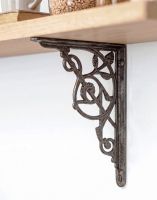 The 24 x 19cm Trellis Iron Shelf Bracket Being Used on DIY Shelving in a Modern Home - Digital Illustration