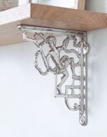 The 24 x 20cm Cherub Design Bright Chrome Bracket on a White Wall in a Modern Home - Digital Illustration The 24 x 20cm Cherub Design Bright Chrome Bracket on a White Wall in a Modern Home - Digital Illustration