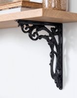 The 24cm x 19cm Ornate Scroll Cast Iron "Victorian Amalina" Bracket Mounted on a Modern White Interior Wall - Digital Illustration The 24cm x 19cm Ornate Scroll Cast Iron "Victorian Amalina" Bracket Mounted on a Modern White Interior Wall - Digital Illustration