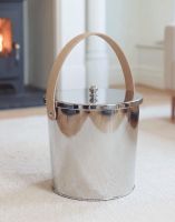 The 25cm Modern Stainless Steel Ash Bucket Displayed in a Contemporary Living Room with a Log Burner - Digital Illustration The 25cm Modern Stainless Steel Ash Bucket Displayed in a Contemporary Living Room with a Log Burner - Digital Illustration