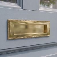 The 25cm Polished Brass Georgian Style Letter Plate on a Light Blue Front Door on a Modern Home - Digital Illustration