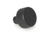 The 25mm "Vesper" Knurled Edge Cabinet Knob in Matt Black on a White Background Shown from the Side