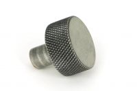 The 25mm "Vesper" Knurled Edge Cabinet Knob in Pewter Displayed on a White Background Shown from the Side