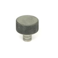 The 25mm "Vesper" Knurled Edge Cabinet Knob in Pewter Displayed on a White Background Stood Upright