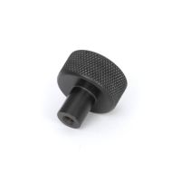 The 25mm Knurled Cabinet Knob (No Rose) in Aged Bronze Seen from Behind on a White Background 