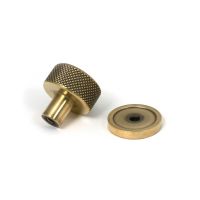 The 25mm Knurled Cabinet Knob on a Plain Rose in Aged Brass Displayed in Separate Sections The 25mm Knurled Cabinet Knob on a Plain Rose in Aged Brass Displayed in Separate Sections