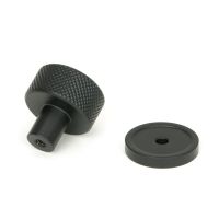 The 25mm Knurled Cabinet Knob on a Plain Rose in Matt Black Displayed in Separate Sections The 25mm Knurled Cabinet Knob on a Plain Rose in Matt Black Displayed in Separate Sections