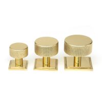 The 25mm Knurled Cabinet Knob on a Square Rose in Polished Brass Alongside Different Sizes 