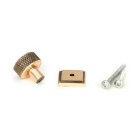The 25mm Knurled Cabinet Knob on a Square Rose in Polished Bronze with Fitting Bolt on a White Background 