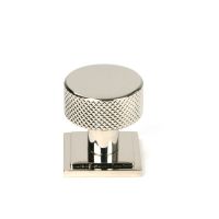The 25mm Knurled Cabinet Knob on a Square Rose in Polished Nickel Shown Upright on a White Background The 25mm Knurled Cabinet Knob on a Square Rose in Polished Nickel Shown Upright on a White Background