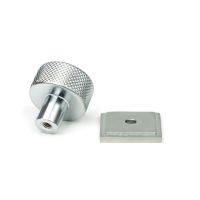 The 25mm Knurled Cabinet Knob on a Square Rose in Satin Chrome Shown from Behind on a White Background
