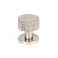 The 25mm Knurled Cabinet Knob on Plain Rose in Satin Stainless Steel Shown Upright on a White Background The 25mm Knurled Cabinet Knob on Plain Rose in Satin Stainless Steel Shown Upright on a White Background