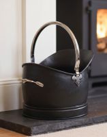 The 27.5cm "Hinswick" Victorian Black Iron and Nickel Coal Bucket Positioned Next to a Decorative Fireplace - Digital Illustration The 27.5cm "Hinswick" Victorian Black Iron and Nickel Coal Bucket Positioned Next to a Decorative Fireplace - Digital Illustration