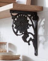 The 27 x 21cm Sunflower Shelf Bracket in Black Iron Mounted on a White Tiled Modern Kitchen - Digital Illustration 