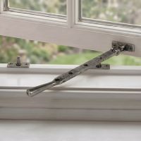 The 296mm 10" Pewter Four Pin Window Stay Fitted on a White Open Window Frame - Digital Illustration The 296mm 10" Pewter Four Pin Window Stay Fitted on a White Open Window Frame - Digital Illustration
