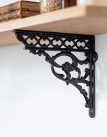 The 29cm x 33cm Serpent Iron Shelf Bracket Mounted on a Cream Coloured Modern Kitchen Wall - Digital Illustration The 29cm x 33cm Serpent Iron Shelf Bracket Mounted on a Cream Coloured Modern Kitchen Wall - Digital Illustration