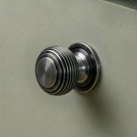The 30mm "Garrison" Ribbed Beehive Knob in a Pewter Finish Fitted on to a Sage Green Kitchen Cupboard - Digital Illustration The 30mm "Garrison" Ribbed Beehive Knob in a Pewter Finish Fitted on to a Sage Green Kitchen Cupboard - Digital Illustration
