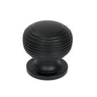 The 30mm "Garrison" Ribbed Beehive Knob in Matt Black on a White Background Shown Upright 