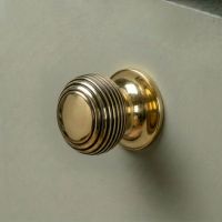 The 30mm Individual Aged Brass Beehive Cabinet Knob Fitted on a DIY Kitchen Cupboard in a Contemporary Home - Digital Illustration The 30mm Individual Aged Brass Beehive Cabinet Knob Fitted on a DIY Kitchen Cupboard in a Contemporary Home - Digital Illustration
