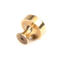 The 32mm "Atelier" Circular Cabinet Knob in Aged Brass on a White Background Shown from Behind