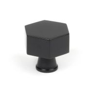 The 32mm "Vanguard" Hexagonal Cabinet Knob in Matt Black on a White Background Shown Stood Upright