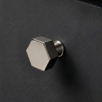 The 32mm "Vanguard" Hexagonal Cabinet Knob in Polished Nickel Mounted on a Charcoal Coloured Kitchen Drawer - Digital Illustration 