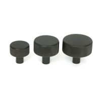 The 32mm Knurled Cabinet Knob (No Rose) in Aged Bronze Alongside Different Sizes