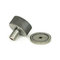 The 32mm Knurled Cabinet Knob on a Plain Rose in Pewter Shown from Behind on a White Background The 32mm Knurled Cabinet Knob on a Plain Rose in Pewter Shown from Behind on a White Background