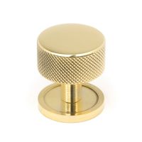 The 32mm Knurled Cabinet Knob on a Plain Rose in Polished Brass Shown Upright on a White Background The 32mm Knurled Cabinet Knob on a Plain Rose in Polished Brass Shown Upright on a White Background