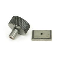 The 32mm Knurled Cabinet Knob on a Square Rose in Pewter Shown from Behind on a White Background The 32mm Knurled Cabinet Knob on a Square Rose in Pewter Shown from Behind on a White Background