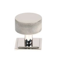The 32mm Knurled Cabinet Knob on a Square Rose in Polished Stainless Steel Shown Upright on a White Background The 32mm Knurled Cabinet Knob on a Square Rose in Polished Stainless Steel Shown Upright on a White Background