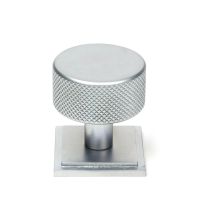 The 32mm Knurled Cabinet Knob on a Square Rose in Satin Chrome Shown Upright on a White Background The 32mm Knurled Cabinet Knob on a Square Rose in Satin Chrome Shown Upright on a White Background